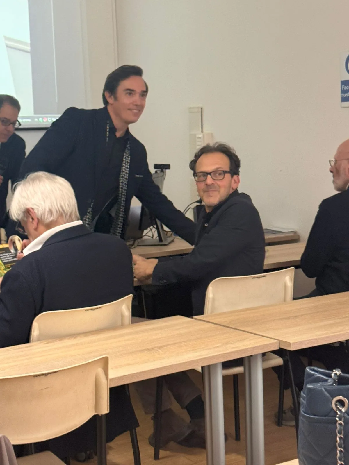 Presentation moment with speakers and audience during the PolisMaker event.