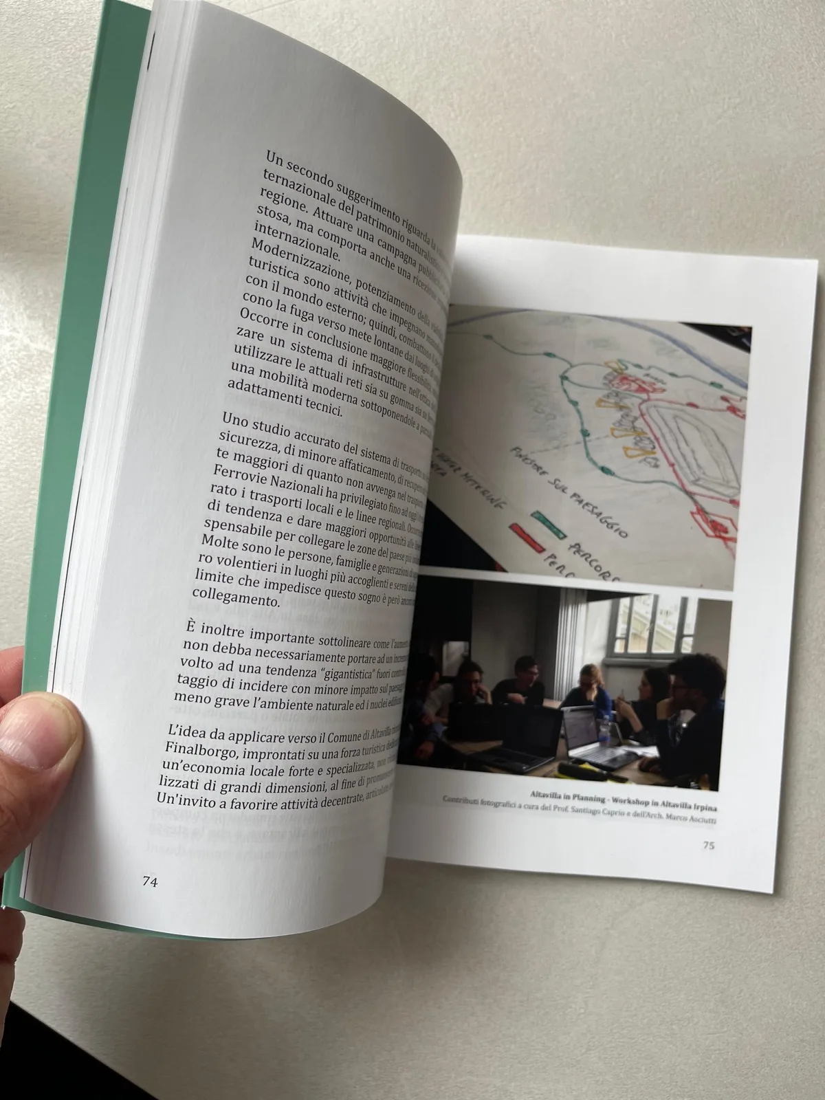 Open pages of the Polis Maker volume presented during the event.